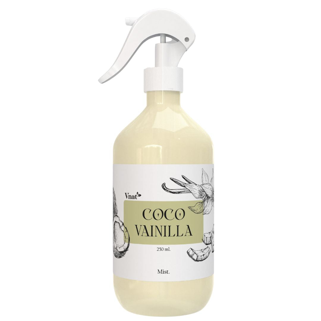 Botella de fragancia Mist de Coco Vainilla de Vnat de 250 ml con ilustraciones de un coco y una hoja de vainilla y etiqueta color beige.